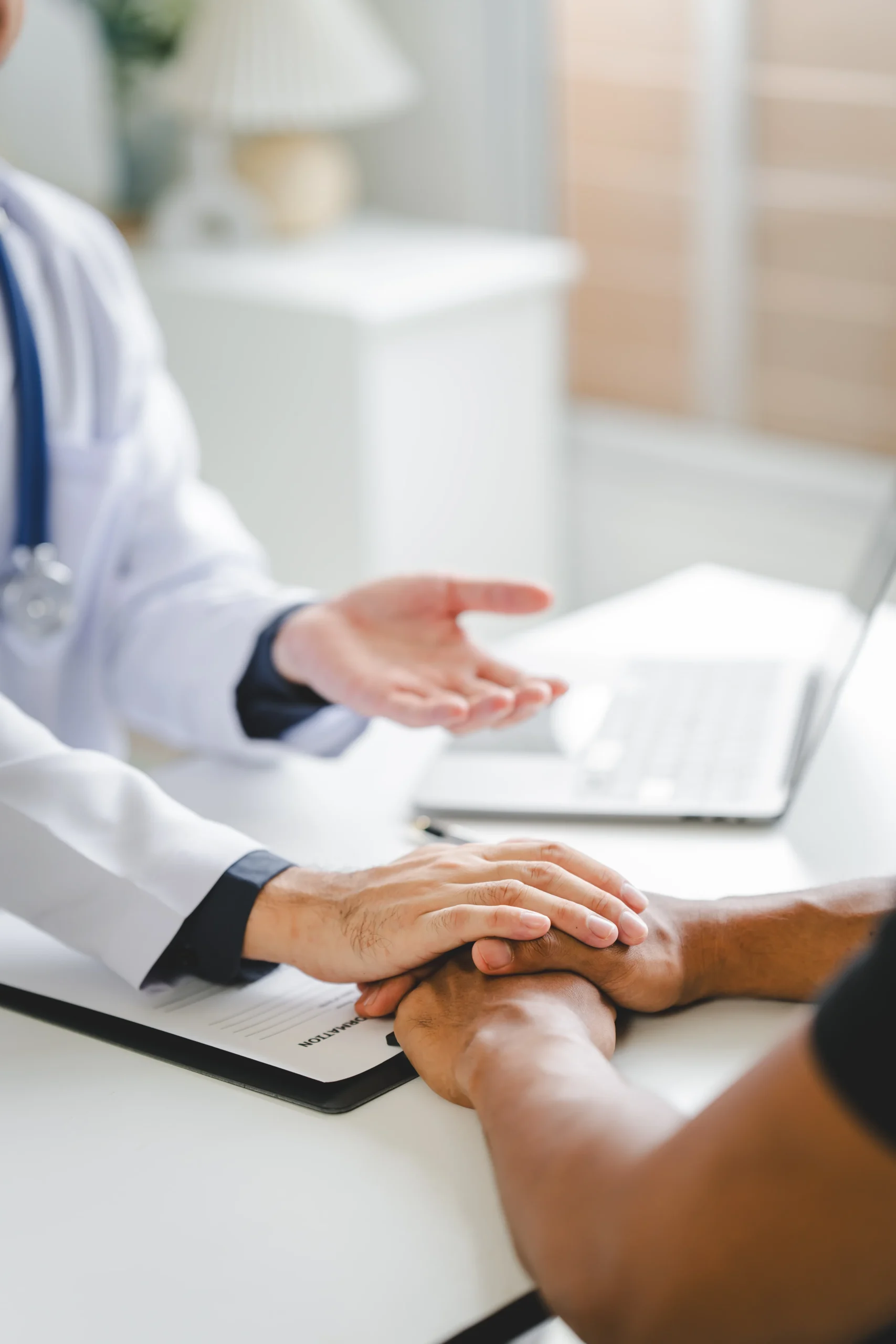 Doctor reassuring a patient before skin cancer surgery